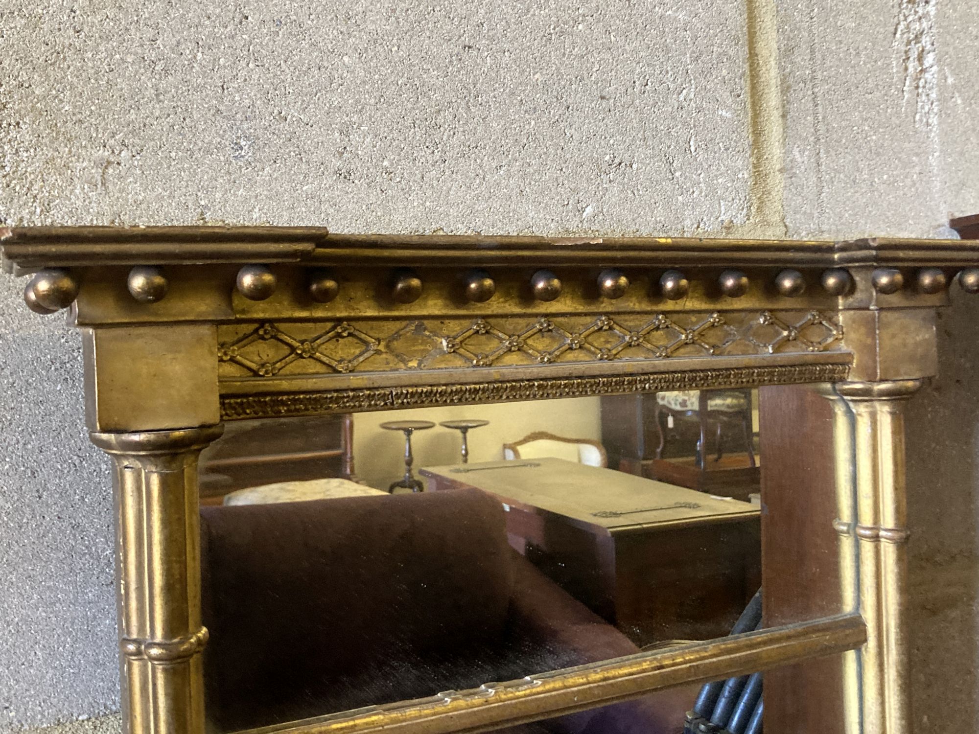 A 19th century rectangular gilt framed wall mirror, with pillar and ball shot frame, width 55cm, height 93cm